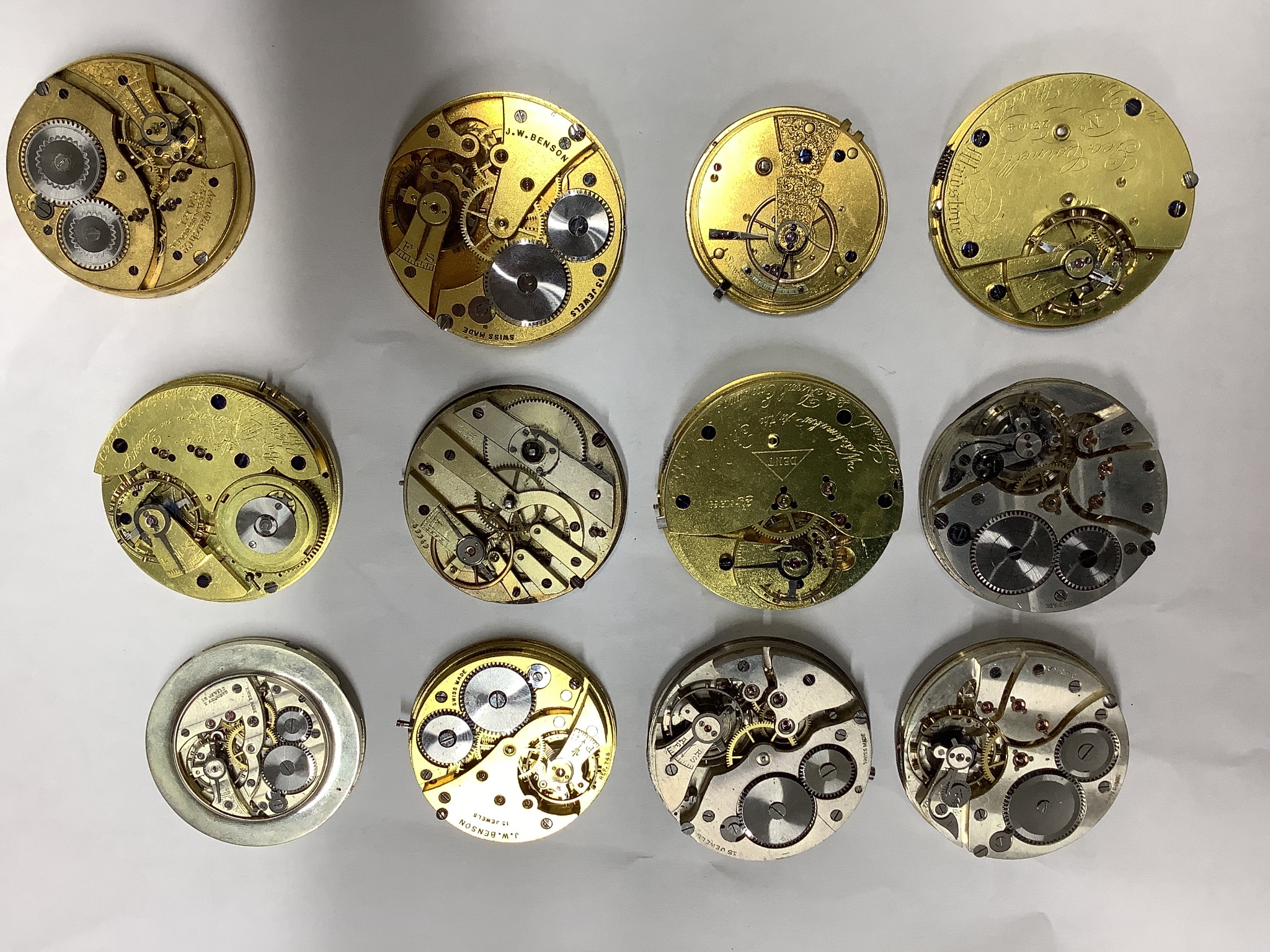 A small collection of assorted pocket watch movements, including Waltham & Tavannes.